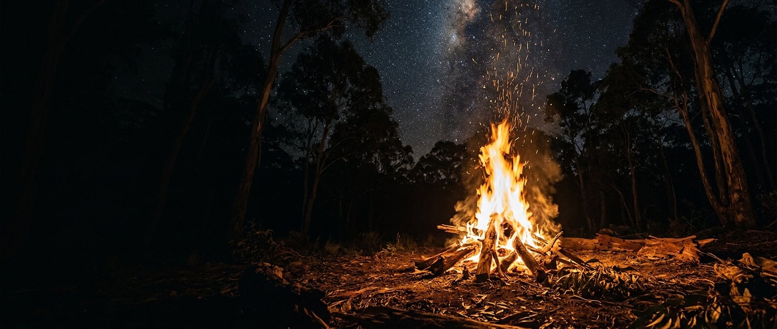 The Sacred Fire blazing at night under the stars in the Australian bush
